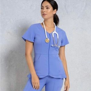 Jaanuu Hudson Collection Ruffle Hem Top in Ceil Blue